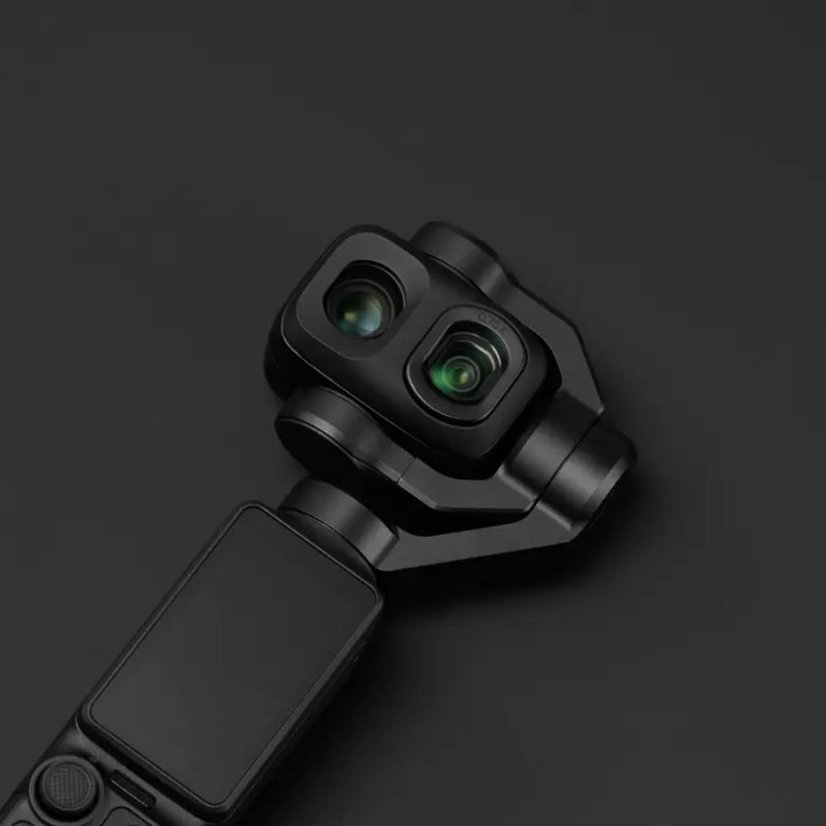 DJI OSMO POCKET 4P WIDE ANGLE LENS GLASS FILTER, A close-up of a black dual-camera gimbal or action camera body on a dark charcoal background.